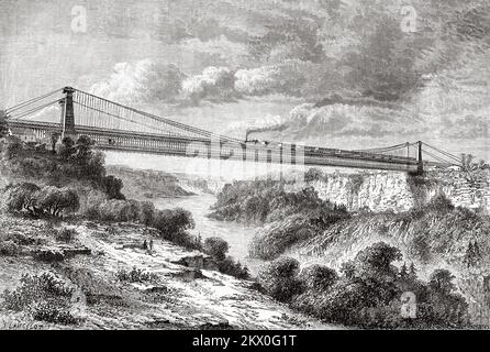 Die Hängebrücke der Great International Railway über den Niagara River. Reisen in Nordamerika von Louis Deville, USA und Kanada 1854-1855. Le Tour du Monde 1861 Uhr Stockfoto