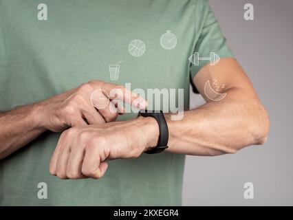 Fitnessarmband, Smartwatch, Tracker am Handgelenk. Mann, der benutzt, klickt auf Smartwatch, um die Aktivität zu steuern. Hochwertiges Foto Stockfoto