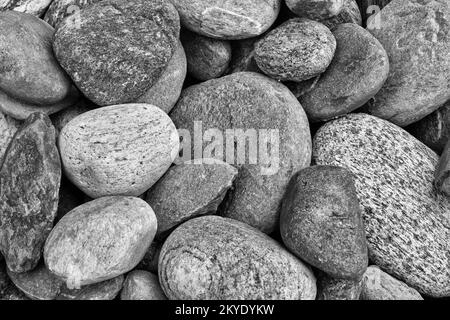 Kleine Struktur aus Seesteinen für einfarbige Hintergrundbilder. Stockfoto