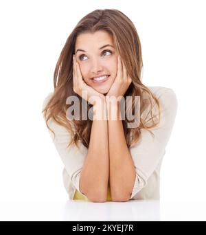 Glückliche Gedanken. Studiofoto einer schönen jungen Frau, die aufmerksam aussieht. Stockfoto