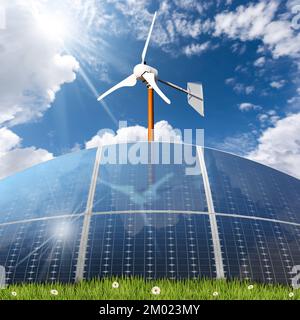 Eine Gruppe von Sonnenkollektoren und eine kleine Windturbine auf einer grünen Wiese mit grünem Gras und Blüten vor einem klaren blauen Himmel mit Wolken. Stockfoto