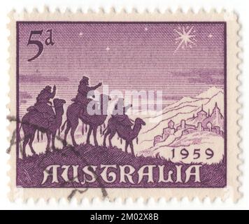 AUSTRALIEN – 1959. November 4: Eine violette Briefmarke mit 5 Pence, die die Weihnachtsszenen der Magi zeigt. Die biblischen Magi, auch als die (drei) Weisen oder (drei) Könige bezeichnet, und auch die drei Magi waren im Evangelium der Matthäus- und christlichen Tradition ausgezeichnete Ausländer. Man sagt, sie hätten Jesus nach seiner Geburt besucht, mit Gaben aus Gold, Weihrauch und Myrrhe. Sie sind regelmäßige Figuren in traditionellen Berichten der Weihnachtsfeierlichkeiten und ein wichtiger Teil der christlichen Tradition Stockfoto