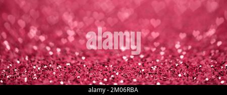 Webbanner zum Valentinstag. Glitzerndes Rot Viva Magenta, glitzernder Hintergrund. Stockfoto