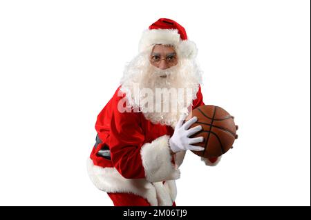 der weihnachtsmann ist bereit, zu weihnachten Basketball zu spielen Stockfoto