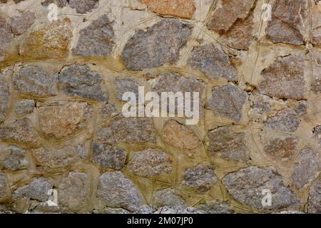 Alte Steinmauer, Nahaufnahme. Hintergrundtextur. Stockfoto