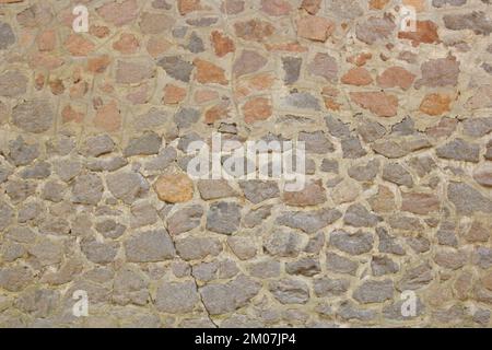 Alte Steinmauer, Nahaufnahme. Hintergrundtextur. Stockfoto
