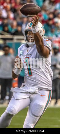 Miami Dolphins quarterback Tua Tagovailoa (1) is interviewed by CBS  reporter Aditi Kinkhabwala on the field after the Dolphins defeated the  Texans with a score of 30-15 during an NFL football game