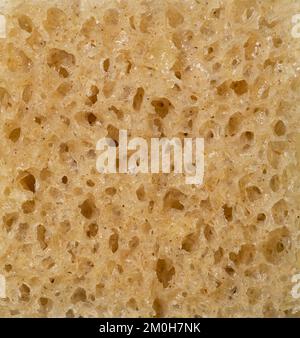 Die Textur des Vollkornbrots als Hintergrund, Nahaufnahme. Makrofoto. Stockfoto