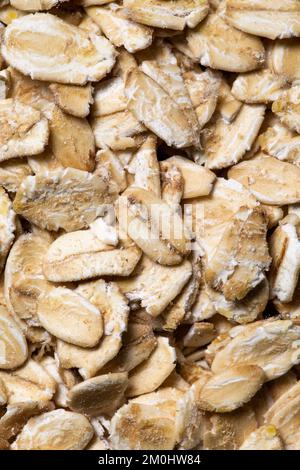 Die Haferflocken-Textur als Hintergrund. Ein Nahschuss Haferflocken. Makro Photo.Oatmeal. Stockfoto