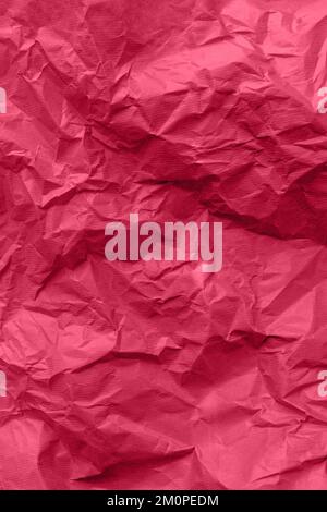 Strukturierter Papierhintergrund. Recyclingpapier, zerknittertes Papier, rot. Stockfoto