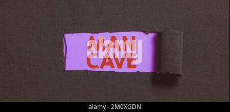 Schrift mit dem Text man Cave. Geschäftsansatz ein Zimmer, eine Fläche oder ein Wohnbereich, der für einen Mann reserviert ist Stockfoto