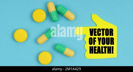 Medizin und Gesundheitskonzept. Auf blauem Hintergrund gibt es Pillen und einen Handaufkleber mit der Inschrift - Ihrer Gesundheit Stockfoto