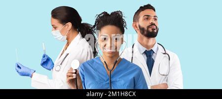 Junge, Multiethnische Ärzte In Uniform Mit Stethoskopen, Die Sich Vor Blauem Hintergrund Posieren Stockfoto