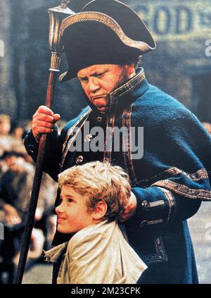 OLIVER ! 1968 Columbia Pictures film with Harry Secombe as Mr. Bumble and Mark Lester as Oliver. Stock Photo