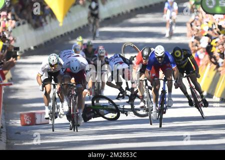 Great Britain Mark Cavendish of Dimension Data and Great Britain's Ben Swift of UAE Team Emirates felt while French Arnaud Demare of FDJ srints to win the fourth stage of the 104th edition of the Tour de France cycling race, 207,5 km from Mondorf-les-Bains, Luxembourg, to Vittel, France, Tuesday 04 July 2017. This year's Tour de France takes place from July first to July 23rd.  BELGA PHOTO DIRK WAEM Stock Photo