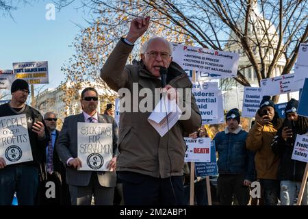 Washington, USA. 13th Dec, 2022. Vermont Sen. Bernie Sanders speaks to rail workers at a union rally near the U.S. Capitol in Washington, DC on Dec. 13, 2022. The International Association of Sheet Metal, Air, Rail and Transportation Workers (SMART) called on Congress to support fair working conditions and paid sick leave for the nation's rail sector, a week after President Joe Biden signed a bill thwarting a freight railroad strike before the holidays. (Photo by Alejandro Alvarez/Sipa USA) Credit: Sipa USA/Alamy Live News Stock Photo