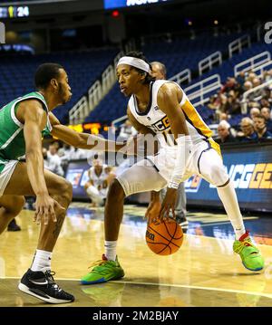 Greensboro Coliseum, Greensboro, NC, USA. 13th Dec, 2022. UNC-Greensboro graduate Keondre Kennedy (11) dribbling ball against Marshall. NCAA basketball game between Marshall University and UNC-Greensboro at Greensboro Coliseum, Greensboro, NC. Final score was UNC-Greensboro 76 and Marshall 67. David Beach/CSM/Alamy Live News Stock Photo