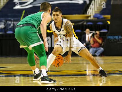 Greensboro Coliseum, Greensboro, NC, USA. 13th Dec, 2022. UNC-Greensboro senior Dante Treacy (24) dribbles the ball against Marshall. NCAA basketball game between Marshall University and UNC-Greensboro at Greensboro Coliseum, Greensboro, NC. Final score was UNC-Greensboro 76 and Marshall 67. David Beach/CSM/Alamy Live News Stock Photo