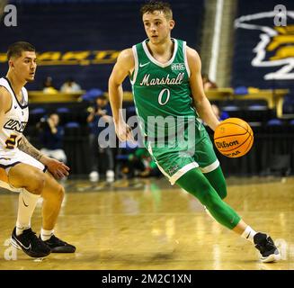 Greensboro Coliseum, Greensboro, NC, USA. 13th Dec, 2022. Marshall University senior Andrew Taylor (0) drives to basket. NCAA basketball game between Marshall University and UNC-Greensboro at Greensboro Coliseum, Greensboro, NC. Final score was UNC-Greensboro 76 and Marshall 67. David Beach/CSM/Alamy Live News Stock Photo