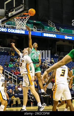 Greensboro Coliseum, Greensboro, NC, USA. 13th Dec, 2022. Marshall University graduate Taevion Kinsey (24) shoots ball. NCAA basketball game between Marshall University and UNC-Greensboro at Greensboro Coliseum, Greensboro, NC. Final score was UNC-Greensboro 76 and Marshall 67. David Beach/CSM/Alamy Live News Stock Photo