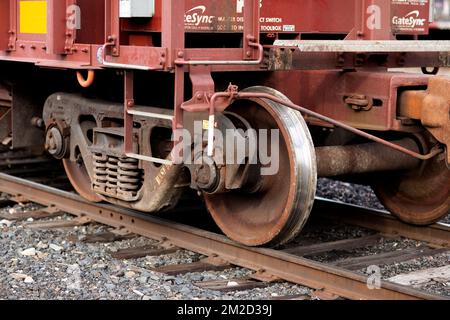 Troy, Montana, USA. February 23, 2021. Railroad hopper car truck wheels and axles on the tracks, at the BNSF railroad yard. Stock Photo