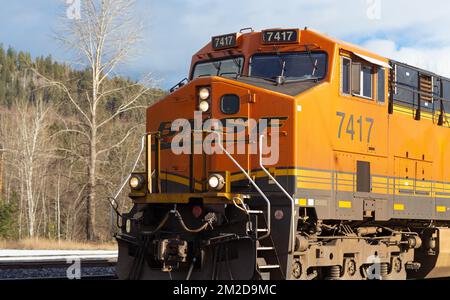 Detail of a BNSF diesel electric train GE ES44AC locomotive number 7417 coming through the rail yard in the town of Troy, Montana. Stock Photo