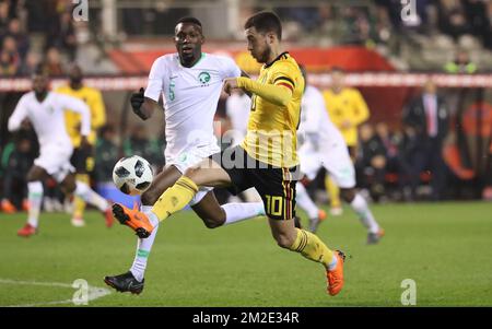 Saudi Arabia's defender Omar Othman and Belgium's captain Eden Hazard fight for the ball during a friendly game between the Red Devils Belgian National soccer team and Saudi Arabia, in Brussels, Tuesday 27 March 2018. BELGA PHOTO VIRGINIE LEFOUR Stock Photo