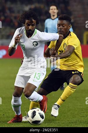 Saudi Arabia's defender Yasser Al-Shahrani and Belgium's Anthony Limbombe pictured in action during a friendly game between the Red Devils Belgian National soccer team and Saudi Arabia, in Brussels, Tuesday 27 March 2018. BELGA PHOTO DIRK WAEM Stock Photo