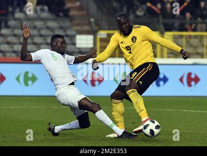 Saudi Arabia's defender Omar Othman and Belgium's Romelu Lukaku pictured in action during a friendly game between the Red Devils Belgian National soccer team and Saudi Arabia, in Brussels, Tuesday 27 March 2018. BELGA PHOTO DIRK WAEM Stock Photo