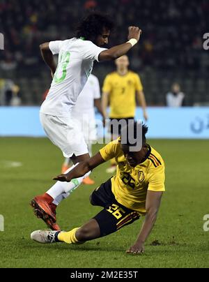 Saudi Arabia's defender Yasser Al-Shahrani and Belgium's Anthony Limbombe pictured in action during a friendly game between the Red Devils Belgian National soccer team and Saudi Arabia, in Brussels, Tuesday 27 March 2018. BELGA PHOTO DIRK WAEM Stock Photo