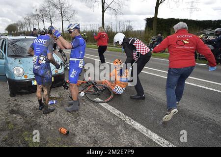 American Travis McCabe of UnitedHealthcare, American Eric Marcotte of UnitedHealthcare and Slovenian Marko Kump of CCC Sprandi Polkowice pictured after a crash during the 106th edition of the 'Scheldeprijs' one day cycling race, 200,4 km from Borsele to Schoten, Wednesday 04 April 2018. BELGA PHOTO YORICK JANSENS Stock Photo