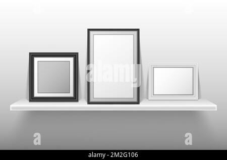 Empty photo frames standing on white shelf. Vector realistic mockup of interior decoration with blank pictures with white and black border. Bookshelf with image frames for home, gallery or portfolio Stock Vector