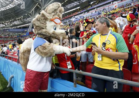 A World Cup fox mascot greets a Brazilian fan, ahead of a soccer game between Belgian national soccer team the Red Devils and Brazil in Kazan, Russia, Friday 06 July 2018, the quarter-finals of the 2018 FIFA World Cup. BELGA PHOTO BRUNO FAHY  Stock Photo