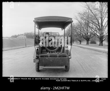 Distribution Department, Emergency Truck No. 2, seats raised showing space for carrying tools and supplies; in front of Chestnut Hill Low Service Pumping Station, Brighton, Mass., Jan. 8, 1917 , waterworks, trucks Stock Photo