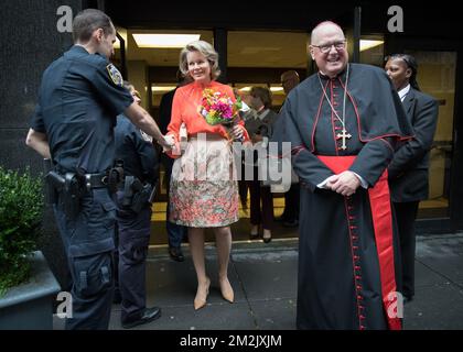 Queen Mathilde of Belgium and Cardinal Timothy Dolan greet police as they leave the Cathedral All Girls High School during the 73th session of the United Nations General Assembly (UNGA 73), in New York City, United States of America, Tuesday 25 September 2018. BELGA PHOTO BENOIT DOPPAGNE Stock Photo