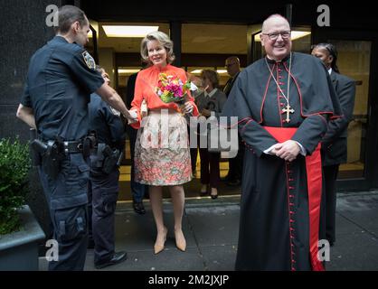 Queen Mathilde of Belgium and Cardinal Timothy Dolan greet police as they leave the Cathedral All Girls High School during the 73th session of the United Nations General Assembly (UNGA 73), in New York City, United States of America, Tuesday 25 September 2018. BELGA PHOTO BENOIT DOPPAGNE Stock Photo