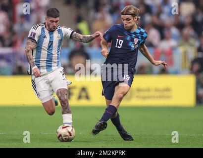 LUSAIL STADIUM, QATAR - DECEMBER 13: Borna Sosa of Croatia and Rodrigo De Paul of Argentina during the FIFA World Cup Qatar 2022 semi-final match between Croatia and Argentina at Lusail Stadium on December 13, 2022 in Qatar. Photo: Igor Kralj/PIXSELL Stock Photo