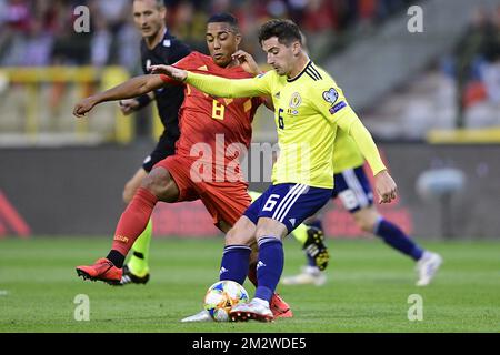 Belgium's Youri Tielemans and Scotland's Kenny McLean fight for the ball during a soccer game between Belgian national team the Red Devils and Scotland, Tuesday 11 June 2019 in Brussels, an UEFA Euro 2020 qualification game. BELGA PHOTO YORICK JANSENS Stock Photo