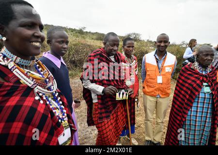 An elderly Maasai man holds a family picture of the Belgian royal family, during a visit to the Il-Bisil Girls' Secondary School in a Maasai Community , on the third day of a royal visit to Kenya, Thursday 27 June 2019, in Kajiado County. Queen Mathilde, honorary President of Unicef Belgium, and Crownprincess Elisabeth are on a three day mission in Kenya with focus on education and children in difficult circumstances. BELGA PHOTO ERIC LALMAND Stock Photo