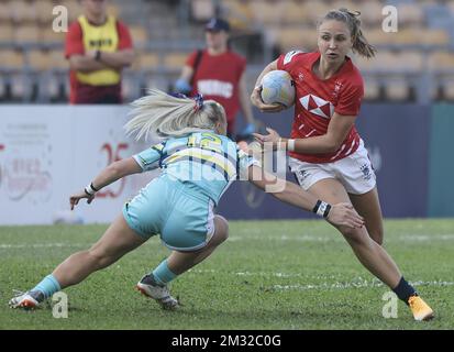 WomenHH first test match between Hong Kong (red) and Kazhakstan (light turquoise), at Siu Sai Wan Sports Ground. In action with ball is Hong KongHH Jessica Eden. 10DEC22 SCMP / Jonathan Wong Stock Photo