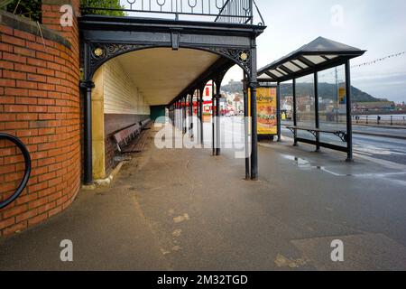 Victorian seaside shelter with long bench on Scarborough seafront during winter time Stock Photo