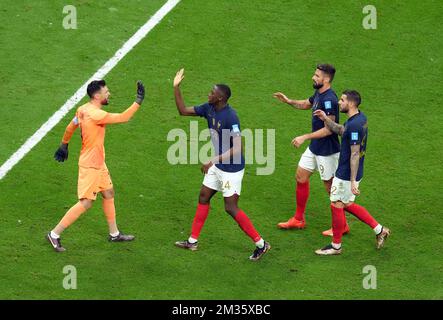 France goalkeeper Hugo Lloris celebrates a save from Morocco's Jawad El Yamiq with his team mates during the FIFA World Cup Semi-Final match at the Al Bayt Stadium in Al Khor, Qatar. Picture date: Wednesday December 14, 2022. Stock Photo