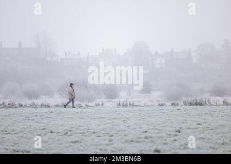 Chester, UK. 12th Dec, 2022. A walker braves the elements as temperatures plumet to -5ºc and freezing fog engulfs the countryside around the city of Chester. Credit: Simon Hyde/Alamy Live News. Stock Photo