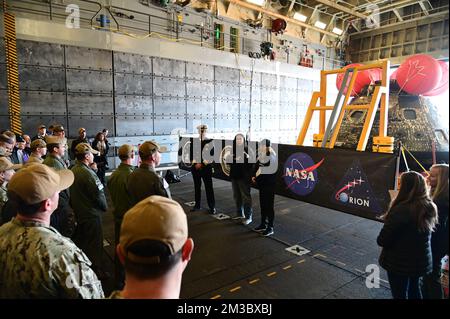 Pacific Ocean. 11th Dec, 2022. Melissa Jones, NASA Landing and Recovery Director, expresses her thanks for the collective efforts to safely recover the Orion capsule aboard the USS Portland. Sailors aboard amphibious transport dock USS Portland (LPD 27) use a line load attenuating mechanism assembly to pull the NASA Artemis I Orion spacecraft into the well deck. (Credit Image: © U.S. Navy/ZUMA Press Wire Service) Stock Photo