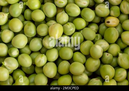 Geschlossene Fotografie zu frischen grünen Erbsen. Stockfoto