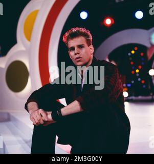 Die Spiebude, ARD Spielshow, Deutschland, 1984, mit Al Corley, Amerikanischer Schauspieler und Sänger. Spielbude, TV-Musikshow, Deutschland, 1984, mit Al Corley, Amerikanischer Schauspieler und Sänger. Stockfoto