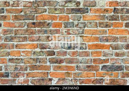 Backsteinmauer. Vollformat, Nahtloses (sich wiederholendes Fliesen) Muster, Textur oder Hintergrund, mit alten britischen Steinen Stockfoto