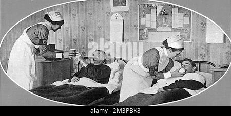 Zwei Krankenschwestern, die dem St. Johns freiwillige Hilfsorganisationen in Frankreich bildeten sich, wie sie sich um verwundete Soldaten kümmerten. Der brassard am rechten Arm trägt ein kreisförmiges Abzeichen, auf dem die Worte „St. John's Ambulance Association." Datum: 1916 Stockfoto