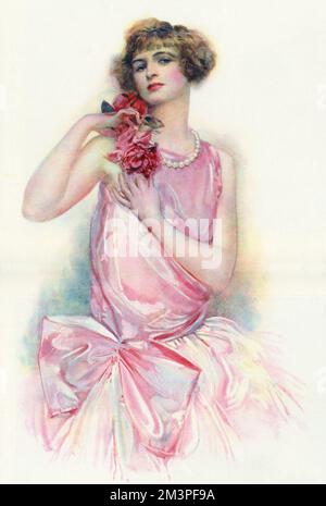 Ein romantisches Bild, auf dem eine junge Frau in Rosa mit bläulichen Rosen zu sehen ist. Datum: 1928 Stockfoto