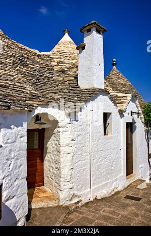 Apulien Apulien Italien. Alberobello. Trulli: Traditionelle apulianische Trockensteinhütten mit einem konischen Dach. Stockfoto